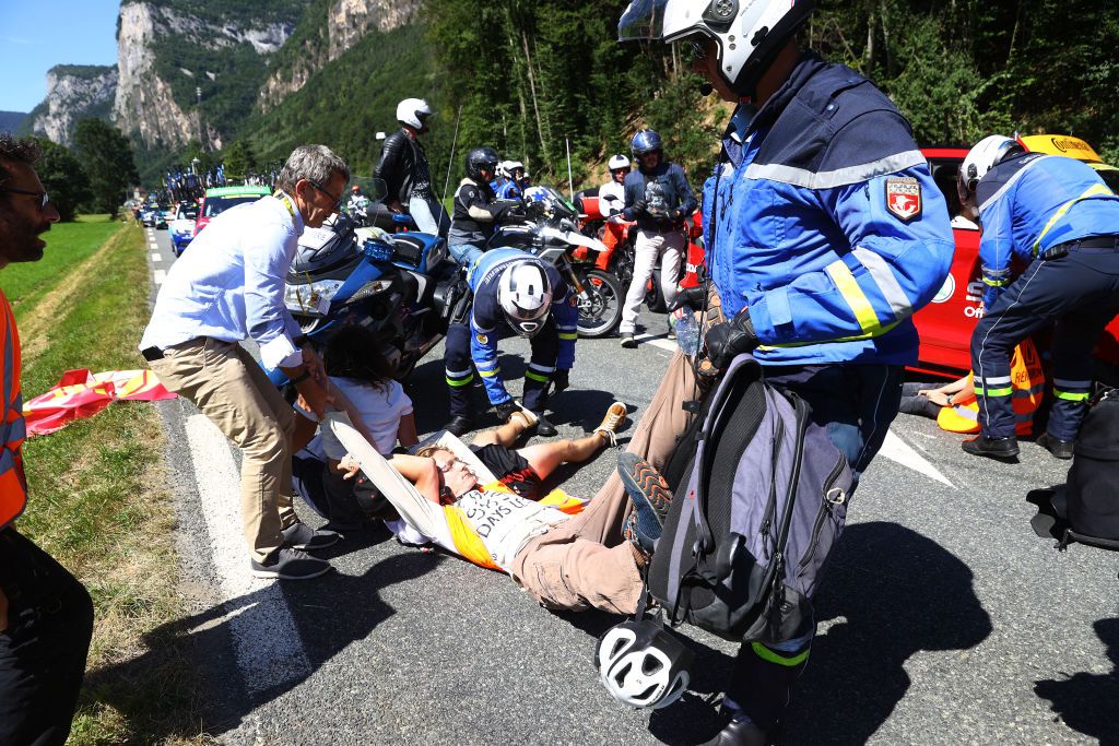 MEGEVE FRANCE JULY 12 Protesters in defending Mont Blanc environment block the route during the 109th Tour de France 2022 Stage 10 a 1481km stage from Morzine to Megve 1435m TDF2022 WorldTour on July 12 2022 in Megeve France Photo by Michael SteeleGetty Images