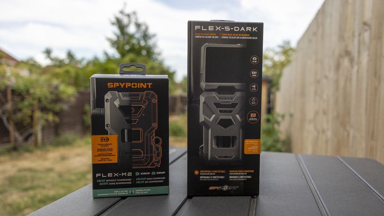 The Spypoint FLEX-S-Dark and M2 trail camera boxes next to each other