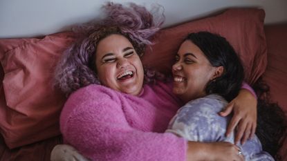  Young couple sharing a joke - stock photo