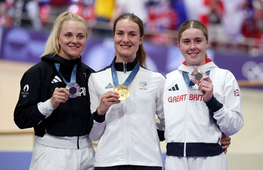PARIS FRANCE AUGUST 11 Gold medalist Ellesse Andrews of Team New Zealand C Silver medalist Lea Friedrich of Team Germany L and Bronze medalist Emma Finucane of Team Great Britain R pose on the podium after the Womens Sprint Finals on day sixteen of the Olympic Games Paris 2024 at SaintQuentinenYvelines Velodrome on August 11 2024 in Paris France Photo by Jared C TiltonGetty Images