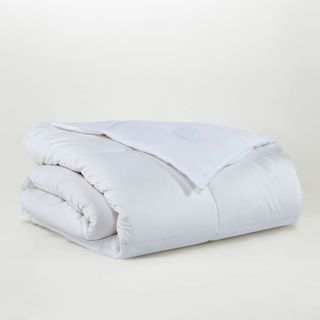 Sijo AiryWeight Cooling Eucalyptus Comforter against a cream background. 