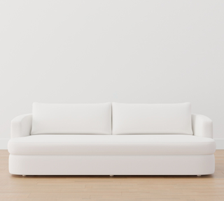 white curved loveseat