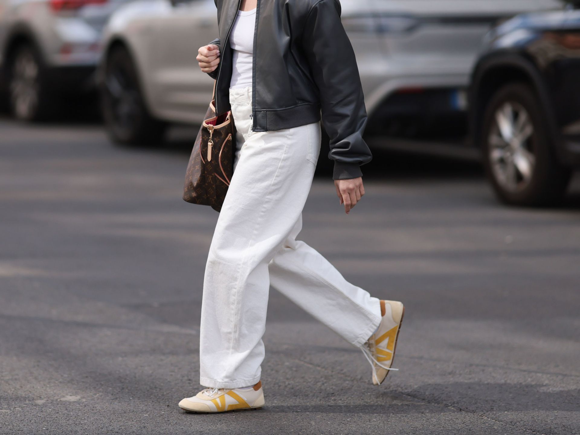 A woman wears Louis Vuitton Sneakerinas.