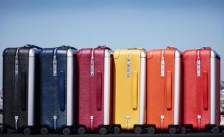 rolling luggage trunks in seven shades