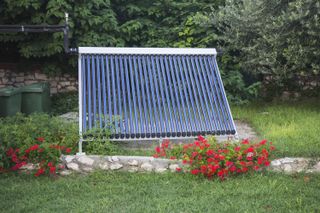 a vacuum solar thermal panel in a garden