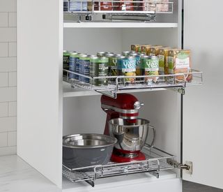 White kitchen storage unit with pull out drawers
