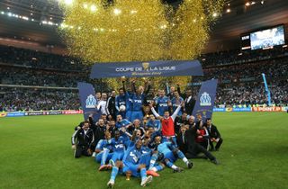 Marseille players celebrate after winning the French League Cup in 2012.