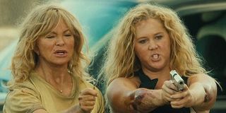 Goldie Hawn and Amy Schumer with weapons in Snatched