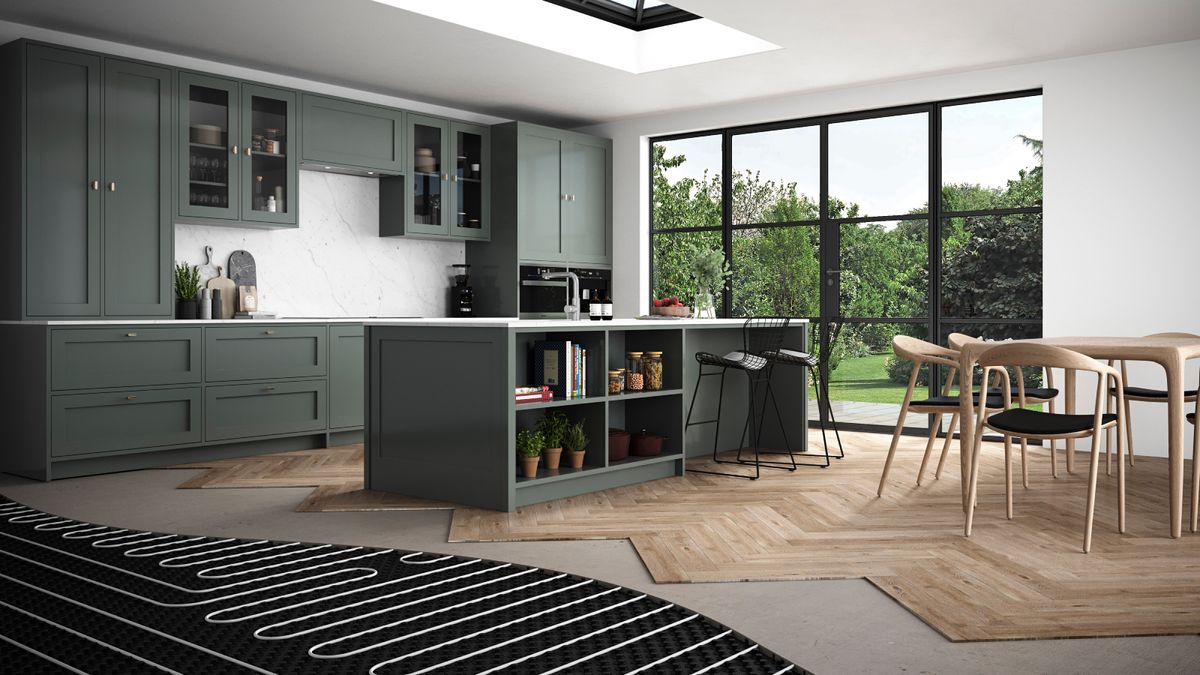 large kitchen diner with green cabinets and part of wooden floor removed showing underfloor heating pipes below