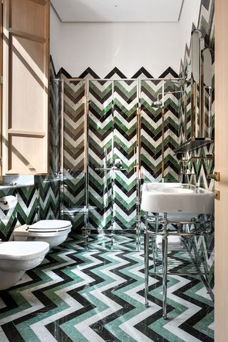 Green bathroom with zig zag tiles