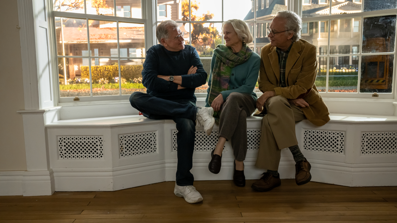 Robert Zemeckis sits on set with Robin Wright and Tom Hanks in old age makeup in Here.