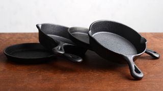 A stack of cast iron skillets
