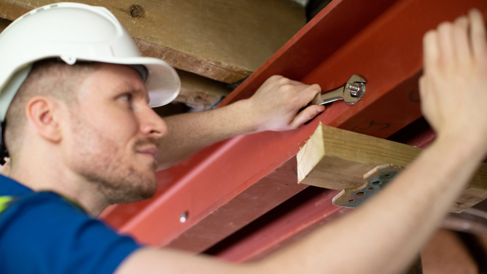 male builder fixing RSJ into place