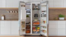 An open fridge in a kitchen, showing storage and organisation