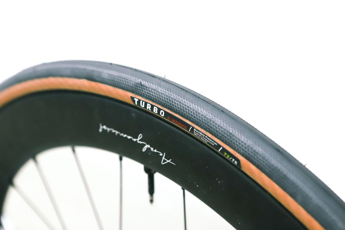 A tan bicycle tyre on a white background