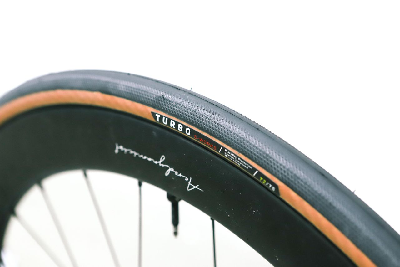 A tan bicycle tyre on a white background
