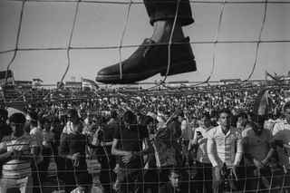 People gather in a stadium during a large rally before the independence referendum. Erbil, Iraq, 2017