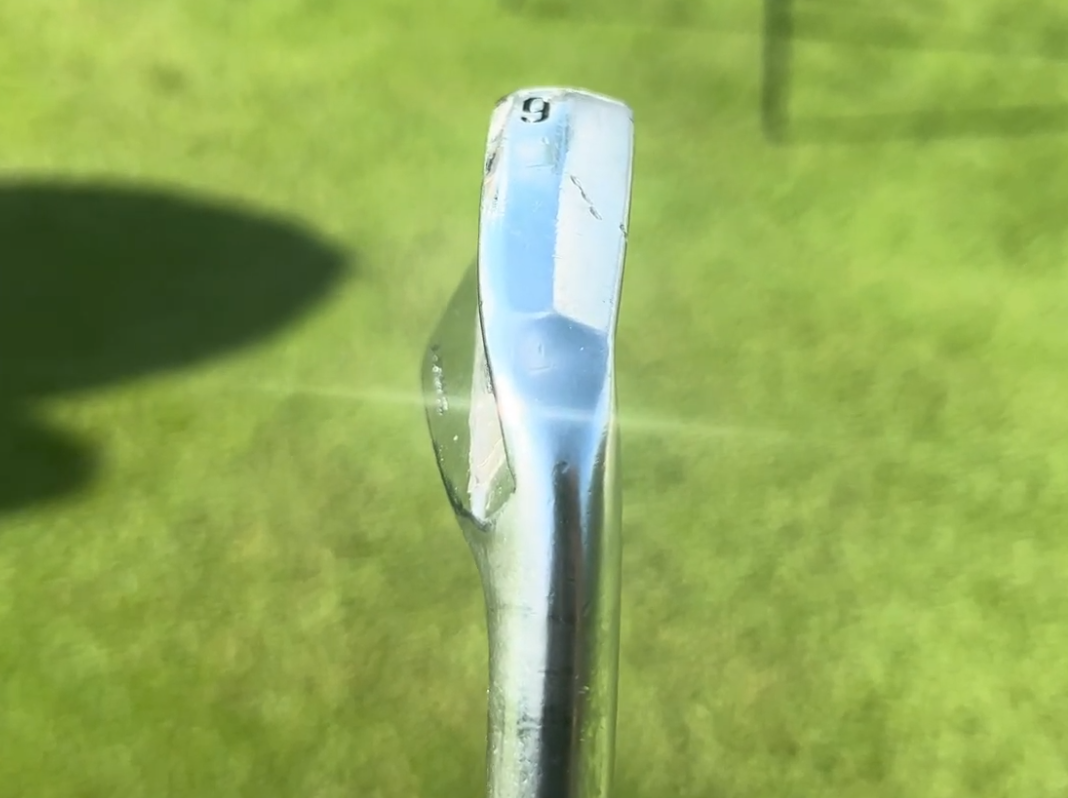 A close-up of David Puig's irons