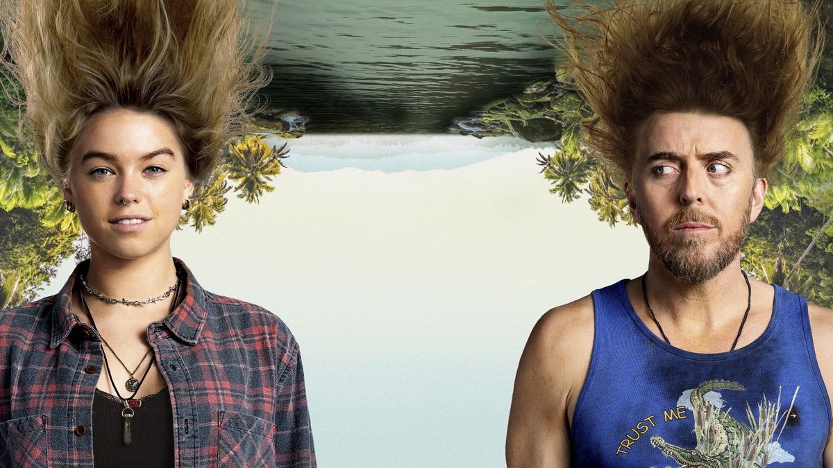 Milly Alcock in a check shirt as Meg and Tim Minchin as Lucky have their hair standing on end in front of an upside-down landscape of a river in Upright