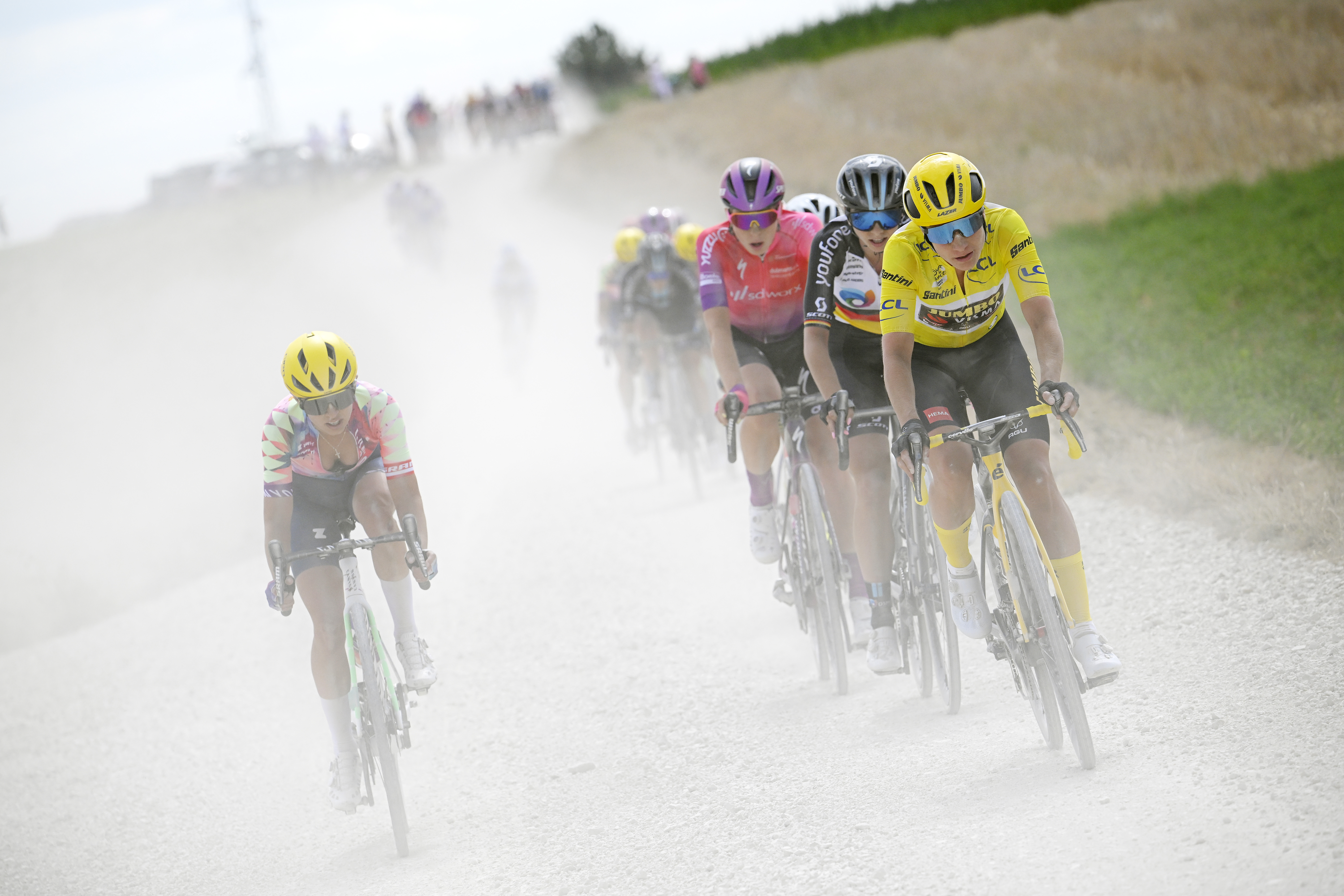 BAR-SUR-AUBE, FRANCE - JULY 27: (L-R) Katarzyna Niewiadoma of Poland and Team Canyon//SRAM Racing, Marlen Reusser of Switzerland and Team SD Worx, Liane Lippert of Germany and Team DSM Women and Marianne Vos of Netherlands and Jumbo Visma Women Team yellow leader jersey compete through gravel roads during the 1st Tour de France Femmes 2022, Stage 4 a 126,8km stage from Troyes to Bar-Sur-Aube / #TDFF / #UCIWWT / on July 27, 2022 in Bar-sur-Aube, France. (Photo by Bernard Papon - Pool/Getty Images)