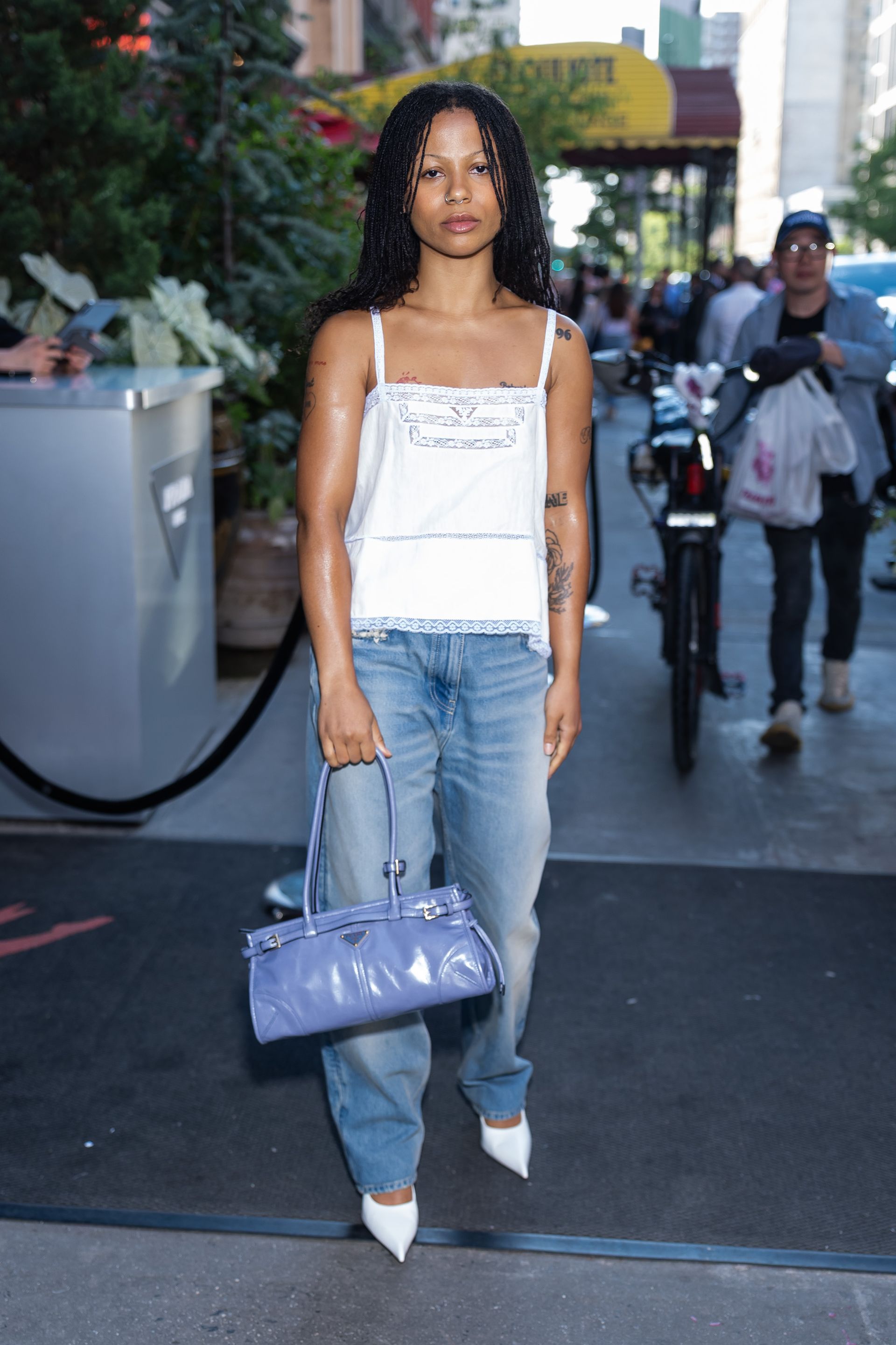 Celebrities wear SS26 trends at the Prada Mode runway show in New York