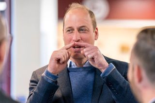 Britain's Prince William, Duke of Cambridge reacts during his visit to Heart of Midlothian Football Club in Edinburgh on May 12, 2022, where he learned about 'The Changing Room' programme launched by SAMH (Scottish Association for Mental Health) in 2018.