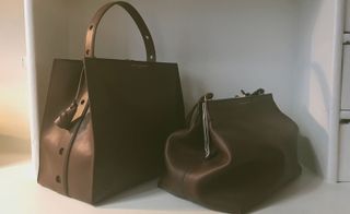 Black leather handbag and pouch