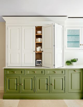 tow-tone kitchen with green and white cabinetry