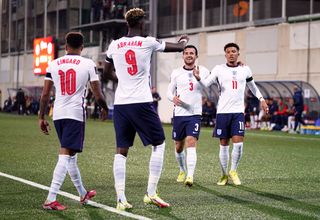 England’s Tammy Abraham celebrates scoring their side’s third goal of the game with Ben Chilwell and Jadon Sancho (right) during the FIFA World Cup Qualifying match at Estadi Nacional, Andorra. Picture date: Saturday October 9, 2021