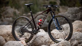 Trek Procaliber Gen 3 side on view on rocks