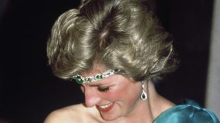 melbourne, australia october 31 diana, princess of wales, wearing a green satin evening dress designed by david and elizabeth emanuel and an emerald necklace as a headband, attends a gala dinner dance at the southern cross hotel on october 31, 1985 in melbourne, australiaphoto by anwar husseingetty images