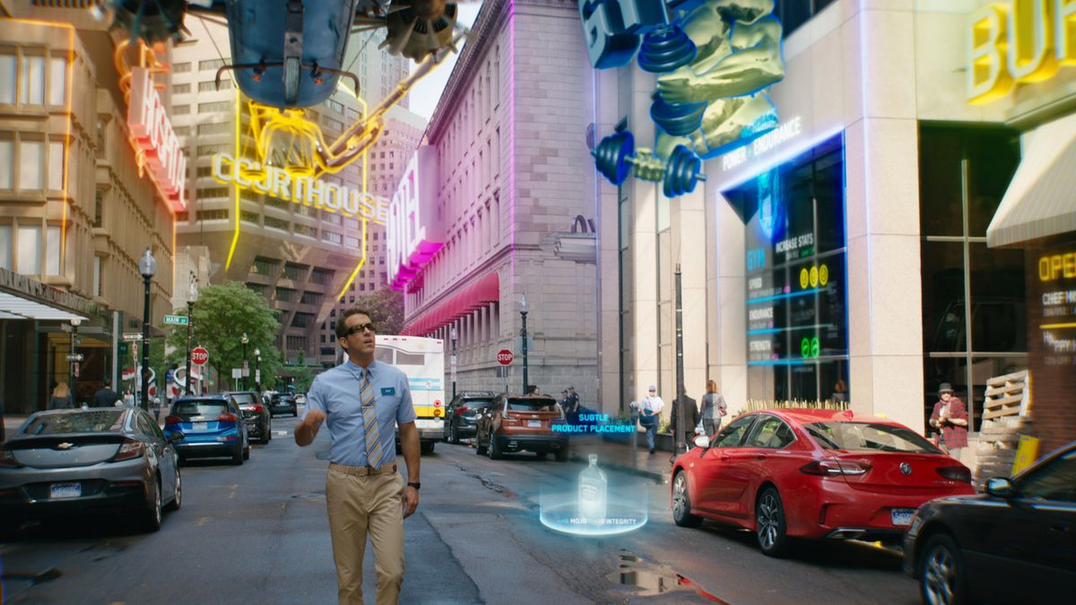 Ryan Reynolds&#039; Guy walking down a street in the movie Free Guy