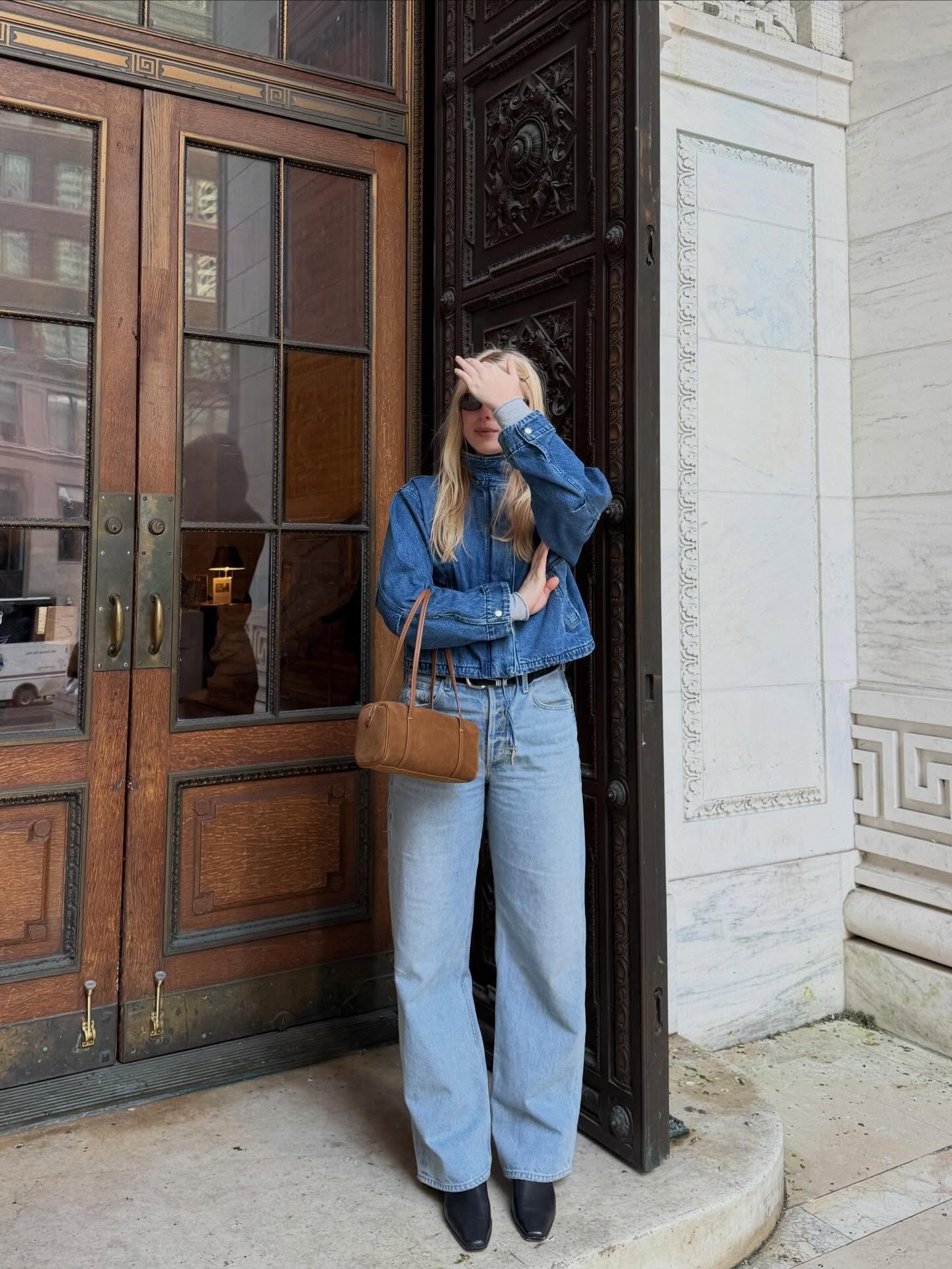 Woman wearing barrel leg jeans.