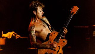 Brian Setzer performs with the Stray Cats at the Town & Country Club in London on October 6, 1992