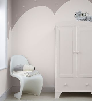 grey and white nursery with wall mural