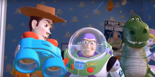 Lenny helps Woody, Buzz, and Rex get a better look at Sid's backyard