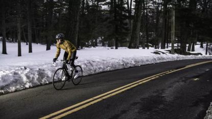 Image shows cycling in the snow