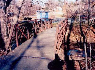 Shown here, the so-called Ellis drop site; under this footbridge over Wolftrap Creek in Vienna, Hanssen placed a package of highly classified information for his Russian handlers to pick up.