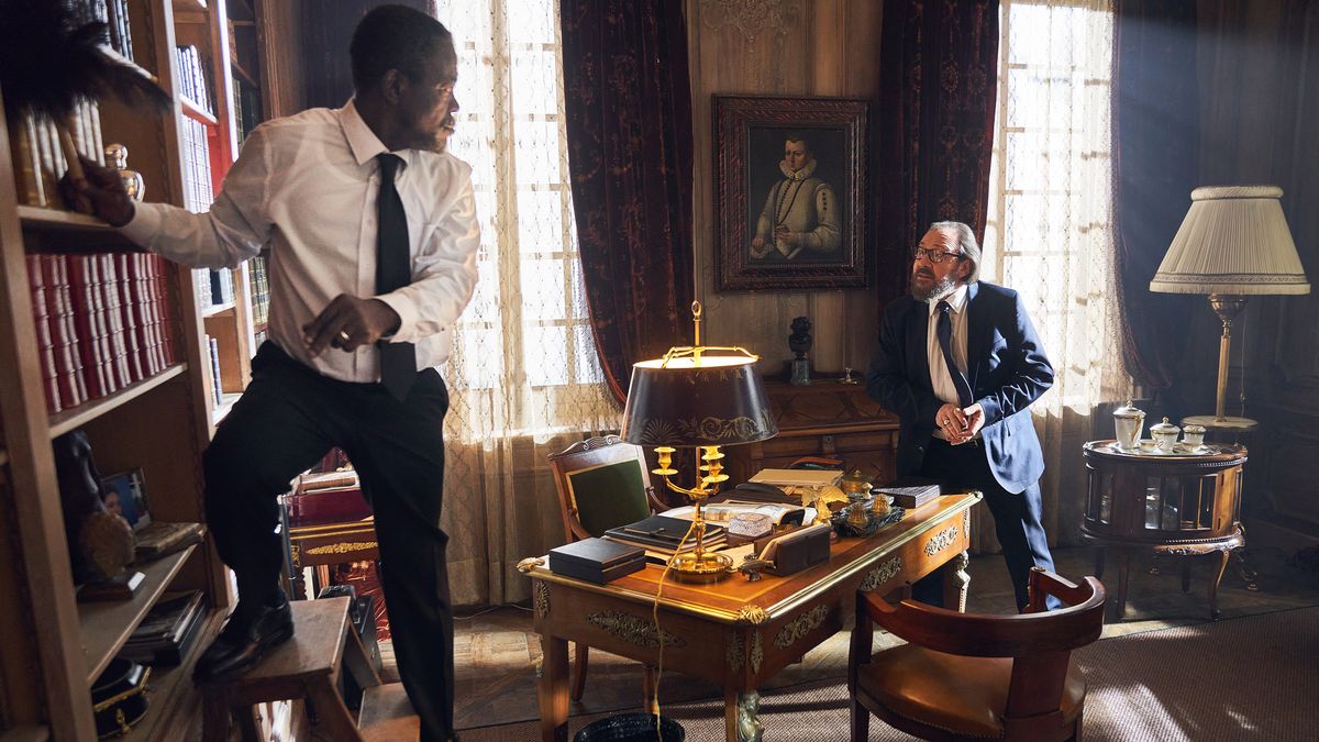 Fargass Assanded as Babakar Diop and Herve Pierre as Hubert Pellegrini in the Netflix series "Lupin."