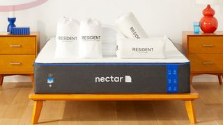 Best mattress: Nectar Memory Foam mattress on a wooden frame in a bedroom setting