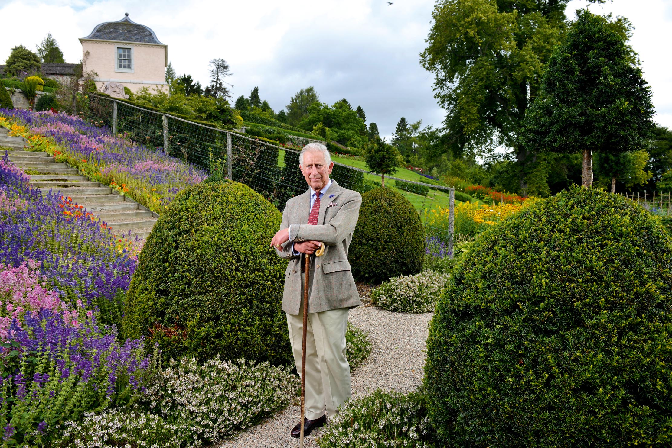 The King below the steps at Birkhall, close to Balmoral. A royal favourite, the lively and productive garden was made by his grandmother Queen Elizabeth.