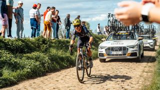 Cyrus Monk (Q36.5 Pro Cycling) races over a cobbled sector solo during the 2024 Paris-Roubaix