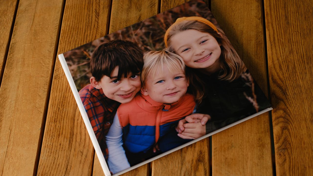 Photo books from Printique on a desktop