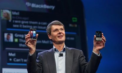 Thorsten Heins, the Chief Executive of BlackBerry shows off the new Blackberry 10 smartphones.