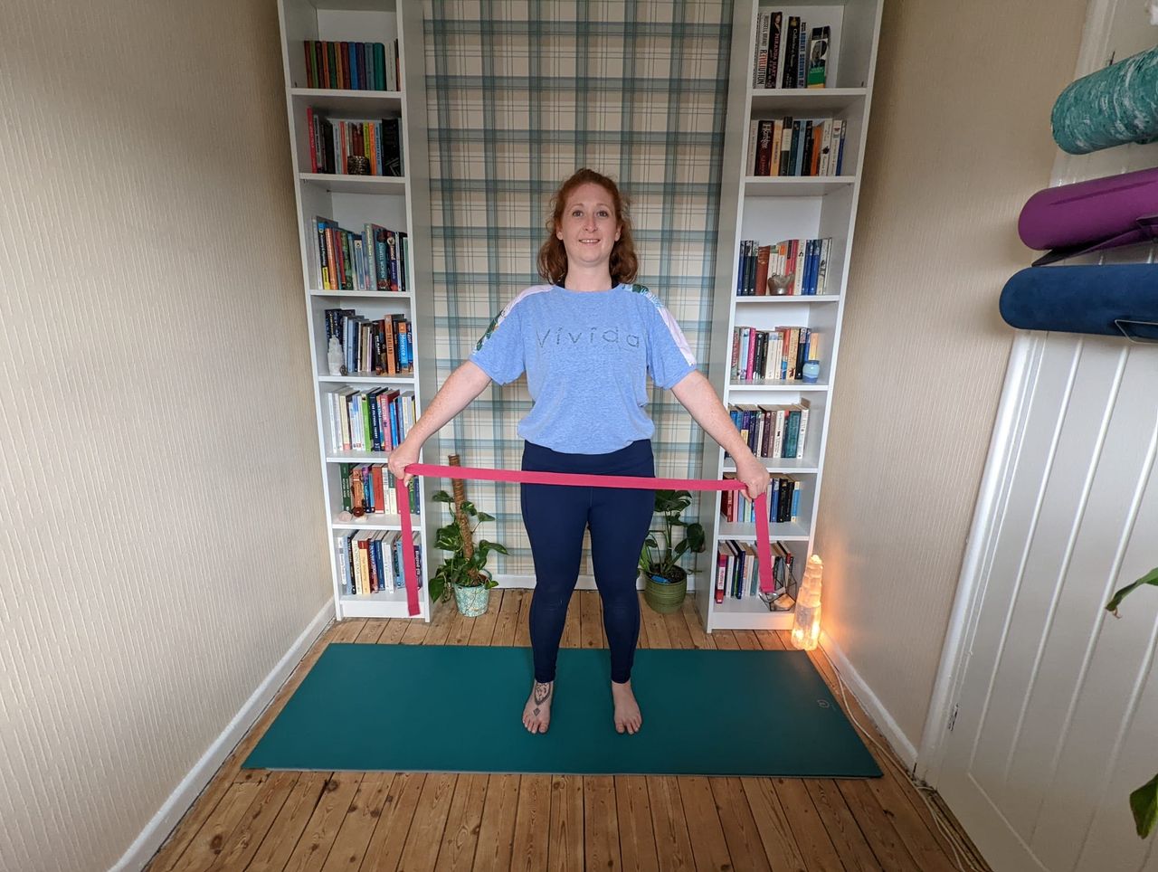Woman doing flexibility exercises with resistance band