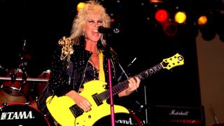Lita Ford plays guitar as she performs onstage at the Aragon Ballroom, Chicago, Illinois, June 11, 1988