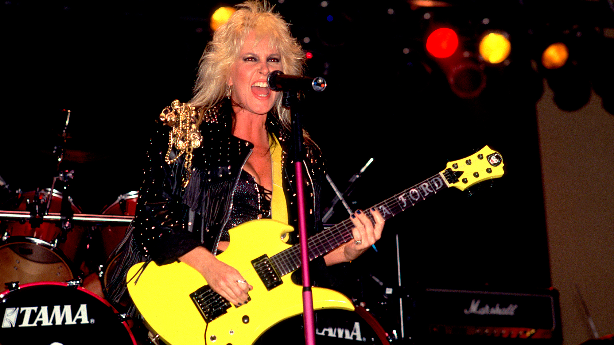 Lita Ford plays guitar as she performs onstage at the Aragon Ballroom, Chicago, Illinois, June 11, 1988