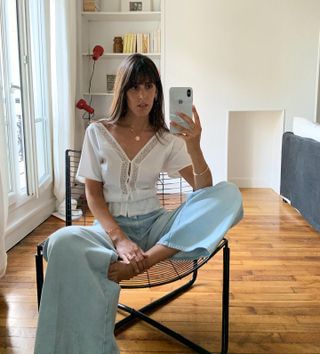 Influencer styles a short sleeve blouse.