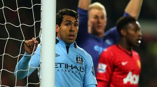 Carlos Tevez in action for Manchester City against former club Manchester United in April 2013.