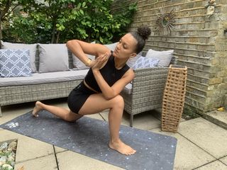 Yoga instructor Simone Venner demonstrates prayer twist